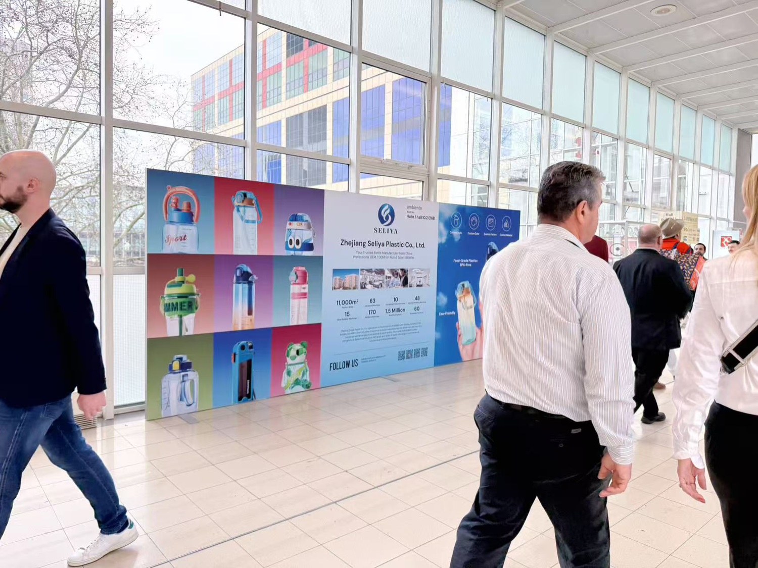 Seliya display board at Ambiente 2026, Messe Frankfurt, with visitors walking past
